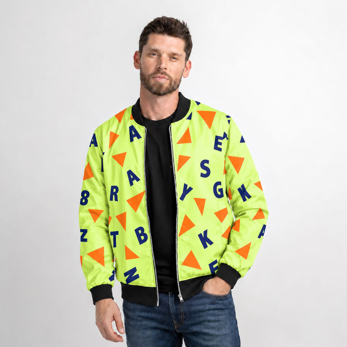 Model wearing Master Roshi tropical bomber jacket with colorful geometric graphics and black ribbed trim