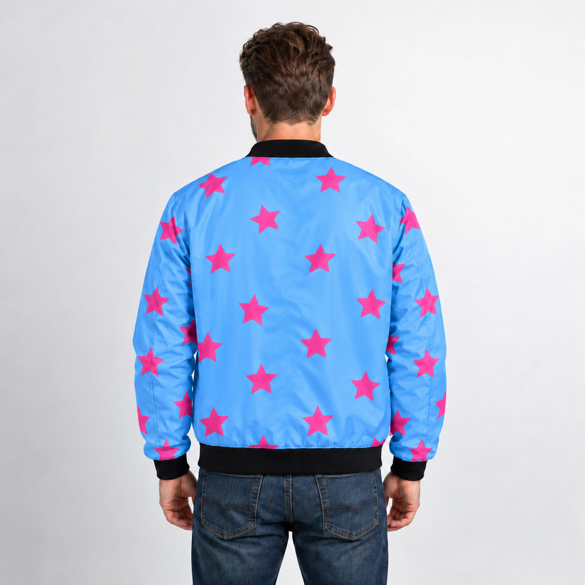 Model wearing sky-blue Johnny Joestar bomber jacket with pink stars across the back