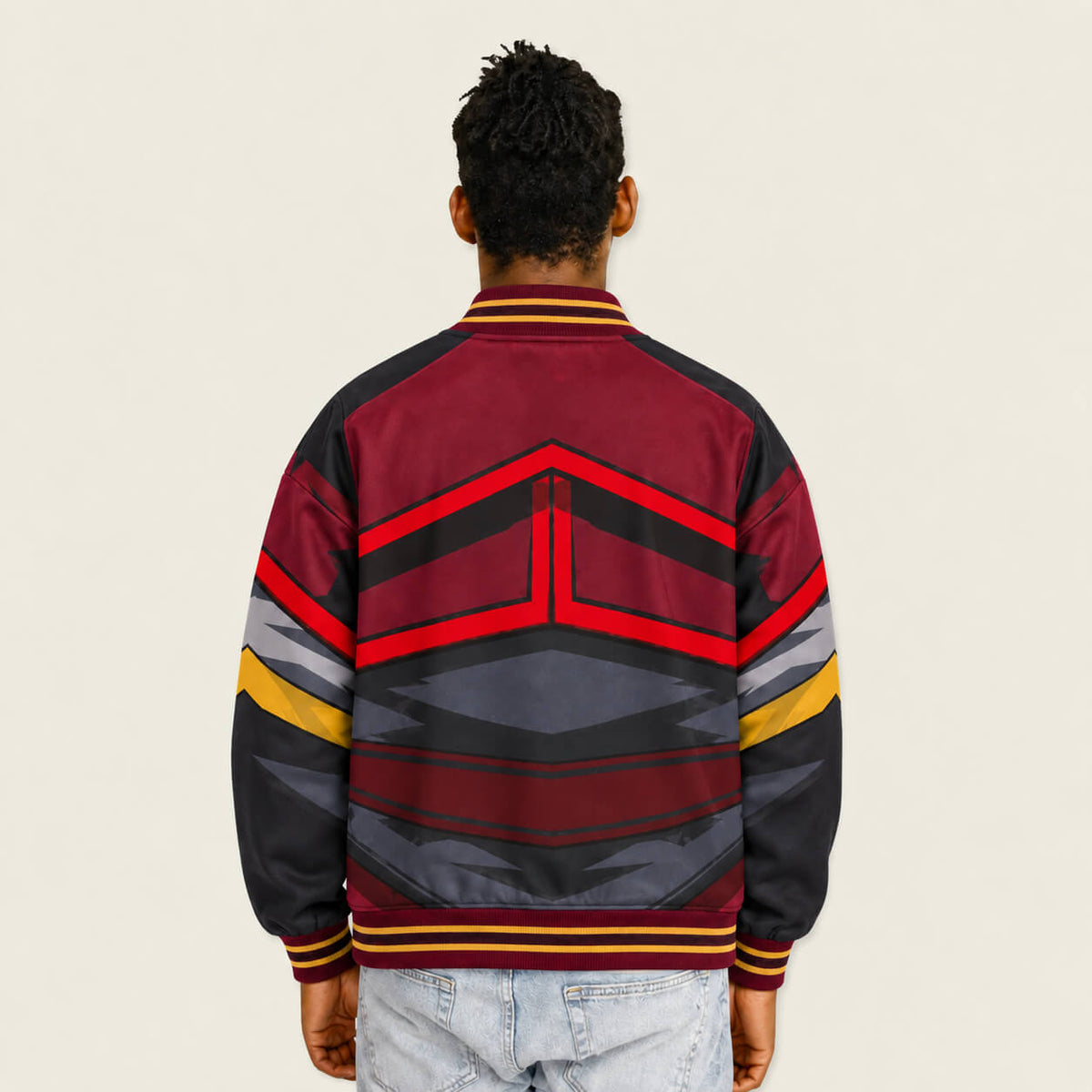 1. Model wearing Avatar Fire Nation varsity jacket back view