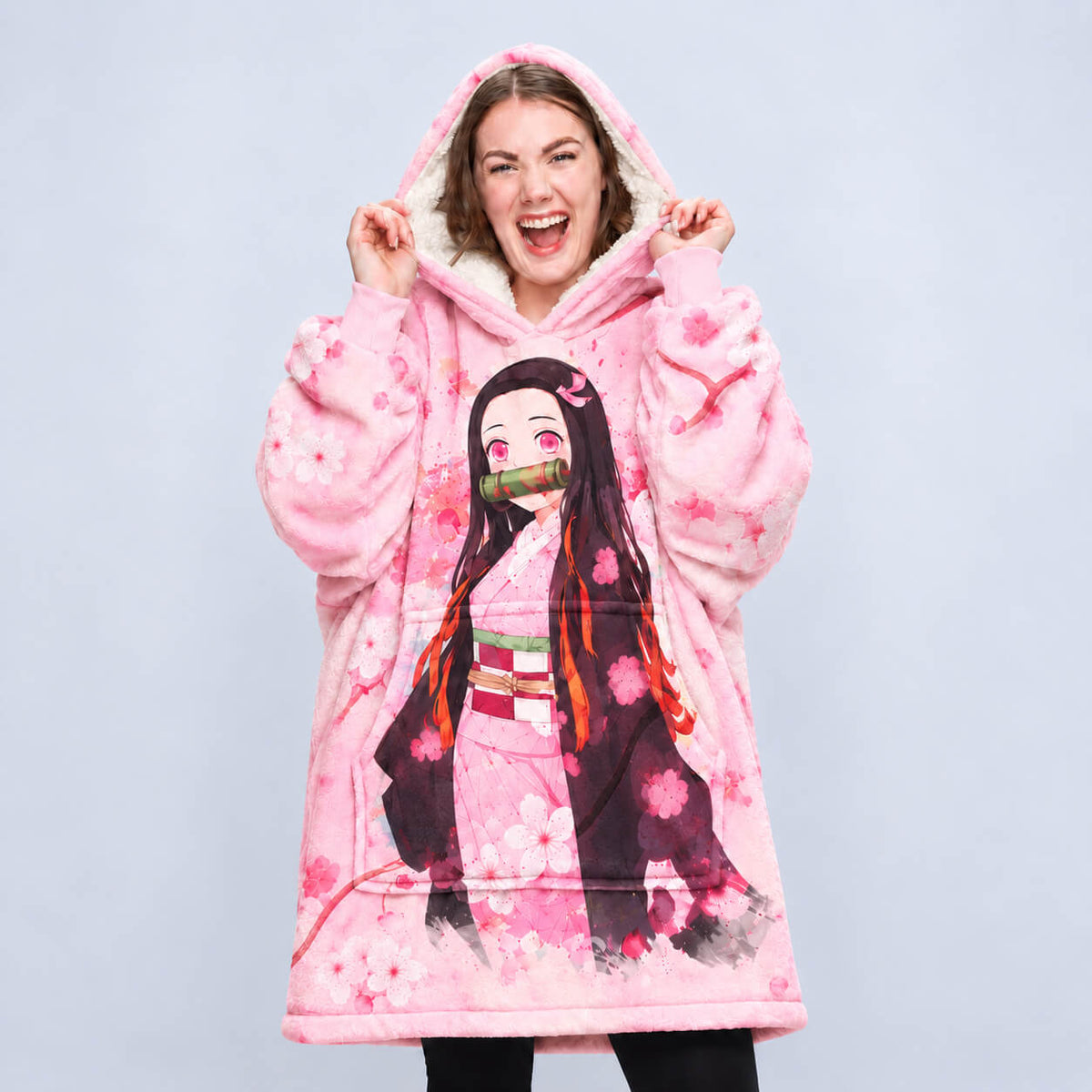 Front view of Nezuko pink blanket hoodie with character artwork