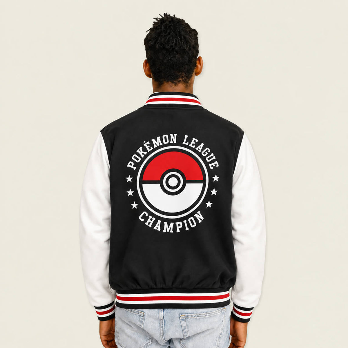1. Model wearing Pokémon Trainer Academy Poké Ball varsity jacket back view