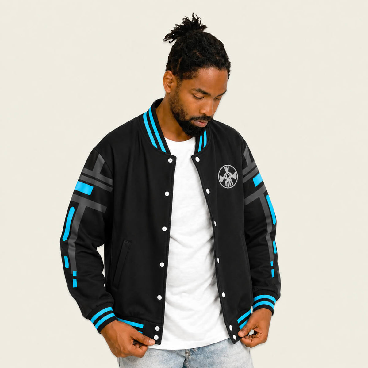 Model wearing Trigun Stampede black varsity jacket front view