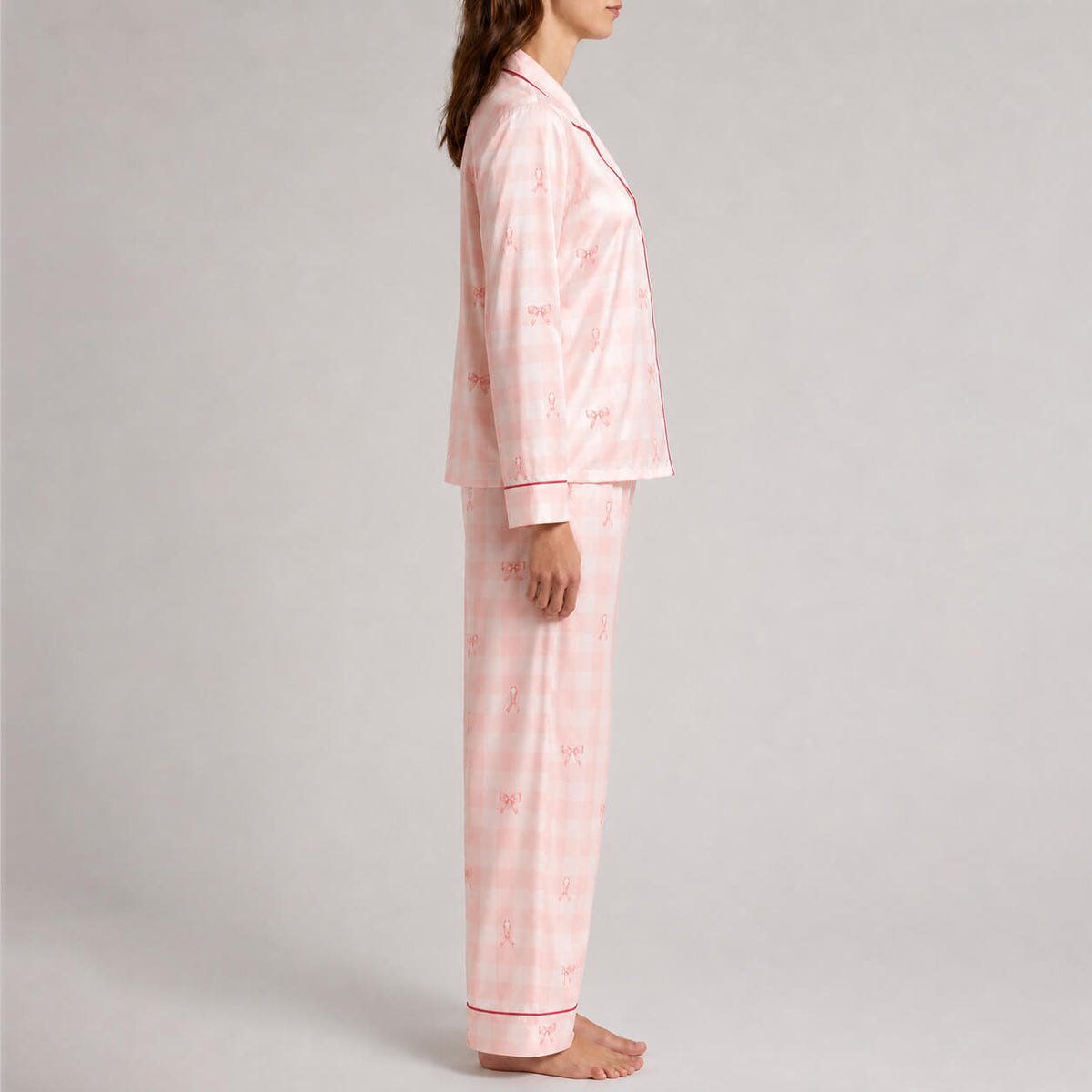 Side view of women’s pink ribbon gingham satin pajama set